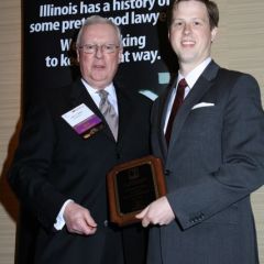 President O'Brien presents a Lincoln Legal Writing Award to Samuel G. Wieczorek