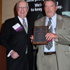 President O'Brien presents the Austin Fleming Newsletter Editor Award to John H. Brechin