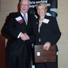 President O'Brien presents a 5-year Newsletter Service Award to Katarinna McBride (accepted on her behalf by Mary Cascino)