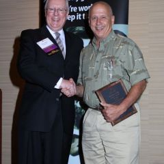 President O'Brien presents a 10-year Newsletter Editor Service Award to Richard Hannigan