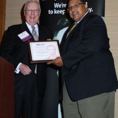 President O'Brien presents the award for Best Live CLE Program to Health Care Section chair Michael Daniels