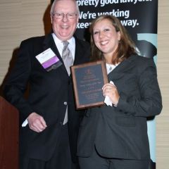 President O'Brien presents an ISBA Young Lawyer of the Year Award to Gina Arquilla DeBoni