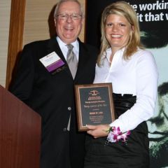 President O'Brien presents an ISBA Young Lawyer of the Year Award to Diana M. Law
