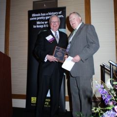 President O'Brien presents a Board of Governors Award to Hon. Alexander P. White