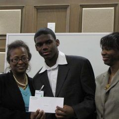 Buford and Perkins present the 2nd place award to Davian Brooks.