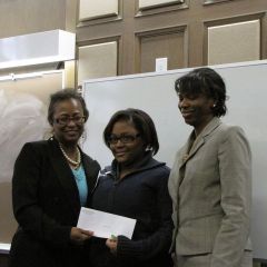 Buford and Perkins present the 1st place student writing award to Brianna Flowers of Frazier Prepatory.