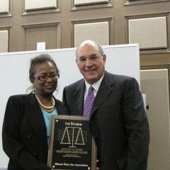 Andrea Buford presents a Law Day award to the ISBA and President-elect Hassakis