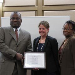 CCBA President Lawrence Hill and CCBF President Angela Buford (right) present Rebecca E. Cahan an award for her firm's support of the Law Day Luncheon.