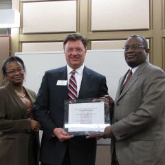 Cook County Bar Foundation President Angela Buford and Cook County Bar Association President Lawrence Hill present ISBA President-elect John Locallo with an award for the ISBA's support of the Cook County Law Day Luncheon.