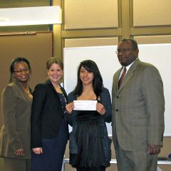 Angela Buford, Rebecca Cahan and Lawrence Hill present a check to 2nd place essay winner Gisel Bahena.