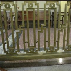 You have to look closely to notice the now-stigmatized shape in the bannister throughout the courthouse.