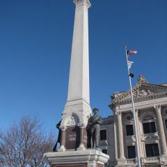 The Civil War monument towers in front of the courthouse.