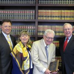 ISBA Immediate Past President John O'Brien presents a Board of Governors Award to Chief Justice Thomas Fitzgerald as ISBA President-elect John Locallo (left) and ISBA 3rd Vice President Paula Holderman look on.