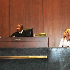 Judge James Rhodes presides over a trial.