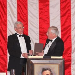 ISBA President O'Brien presents "The Papers of Abraham Lincoln" to Peoria County Bar President Timothy J. Cassidy.