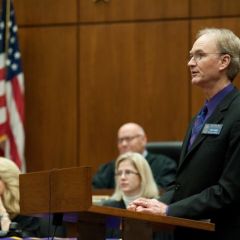 Phi Alpha Delta District XI Justice John Norris welcomes the initiates to the fraternity.