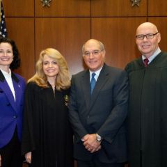 Fraternity initiates Jayne Reardon (left), Executive Director of the Illinois Supreme Court's Commission on Professionalism and Mark Hassakis (2nd from right), President-Elect of the Illinois State Bar Association, are congratulated by Michele Jochner, Chicago Alumni Chapter Justice and Chief Judge James F. Holderman, Honorary Board Chair of the Chicago Alumni Chapter. 
