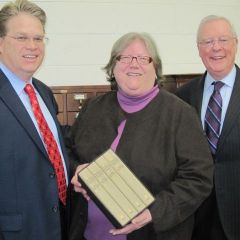 President O'Brien (right) is joined by St. Clair County Bar Association President Charles Swartwout to present the four-volume set to Belleville Public Library director Harriett Zipfel.