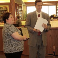Illinois State Bar Association member Eric J. Dirnbeck, of Benton, presented a four-volume set of books, The Papers of Abraham Lincoln, to the Benton Public Library on April 13, as a gift from the ISBA and its charitable arm, the Illinois Bar Foundation. Accepting the books is Erin Steinsultz, library director. Also on hand for the presentation were (not pictured) attorneys Richard T. Lewis, David B. Garavalia, and Tracy L. Prosser, and Judge Loren P. Lewis, all of Benton.