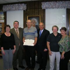 ISBA President-elect recently presented the Carlyle library with "The Papers of Abraham Lincoln." On hand for the presentation were (left to right): Barbara Guebert, Board of Trustees; John A. Hudspeth Jr., State's Attorney; Jim Roeckeman, Library Director; Mark D. Hassakis; Sue Largent, Carlyle High School teacher; Sharon Berdeaux, President Board of Trustees  