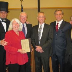 ISBA President John O'Brien present to the "Papers of Abraham Lincoln" to the Freeport Library.