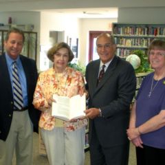 ISBA President-elect Mark Hassakis presented "The Papers of Abraham Lincoln" to the Harrisburg library on May 25. On hand for the presentation were: Hon. Bruce Stewart, Library Trustee Lynda Clemmons, President-elect Hassakis and Children's Librarian Kae McCue.