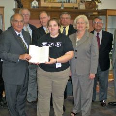ISBA President-elect recently presented "The Papers" to the Mattoon library. On hand for the presentation were (front row: left to right): President-elect Hassakis, Director Ryan Franklin, Janet Grove; Back row (left to right): Stanton Dotson, John Barger, Greg Ray, Kent Heller, Steve Corn, Mark Ferguson