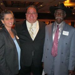  St. Clair County Bar president Kevin Hoerner congratulates Sheila Burton, recipient of the Hudlin Memorial Award recognizing outstanding community service by a lawyer, and Rev. Dorris Davis. Burton created and operates Join Hands ESL, which mentors impoverished children in East St. Louis. Rev. Davis operates a shelter for homeless men in East St. Louis.