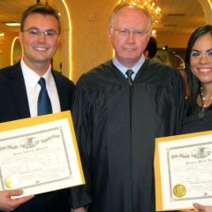 New admittee Clark Miljush, Chief Justice Thomas L. Kilbride and new admittee Pamela Dones