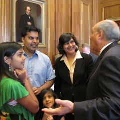 ISBA President Mark D. Hassakis meets with new admittee Sonali Sinha Srivastava and her family