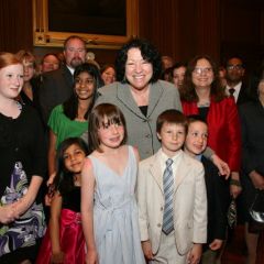 U.S. Supreme Court Justice Sonia Sotomayor poses with the children of the new admittees.