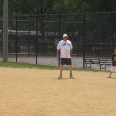 ISBA Board member Jim McCluskey got the team's first hit.
