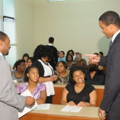 Teachers Tyreese Foreman and Terrance Garmon chat with students