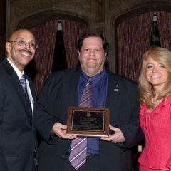 Pierre Priestley and Michele Jochner present a Chicago Alumni Chapter Centennial Award to past Chapter Justice, BJ Maley