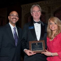 Pierre Priestley and Michele Jochner present a Chicago Alumni Chapter Centennial Award to past Chapter Justice, John K. Norris