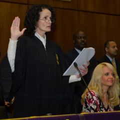 Jayne Reardon administers the oath of initiation 
