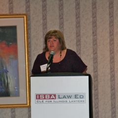 ISBA Board member Lisa Nyuli introduces Chief Justice Kilbride