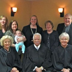 New Admittee Catherine Howlett and family with the Supreme Court Justices