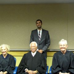 New admittee Andrew Bashi with Justices Burke, Freeman and Theis