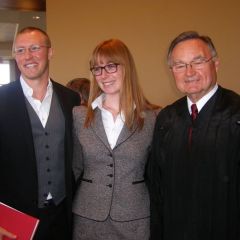 Pictured with new admittee Theresa Mohim are Jeff Carroll and Supreme Court Justice Lloyd A. Karmeier.