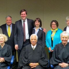 New admittees and married couple John Christopher Fitzpatrick and Jessica Tagatz (rear, middle) Fitzpatrick with family and Illinois Supreme Court Justices Anne Burke, Charles Freeman and Mary Jane Theis. 