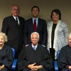 New admittee Benjamin Goluska and family with Justices Burke, Freeman and Theis.