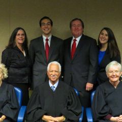 New admittee Matthew Howeth and family with Justices Burke, Freeman and Theis.
