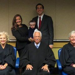 New admittees Kristin Creed and Matthew Howeth with their daughter Jordyn Rose with Justices Burke, Freeman and Theis.
