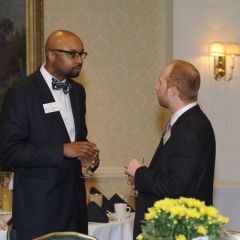 ISBA 2nd Vice President Vincent Cornelius (left) speaks with an attendee