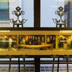 President Umberto S. Davi presented a portrait from a 2001 Board meeting held in Taylorville during the presidency of J. Timothy Eaton. 