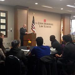 Presiding Judge of the Law Division in the Cook County Circuit Court - the Honorable James Flannery Speaking to the audience. 