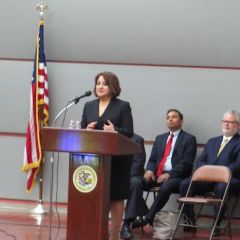 Claudia Castro delivers a speech to new admittees