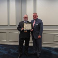 Curtis Ross, Presidential Commendations Award recipient,&nbsp;and President Russell Hartigan

