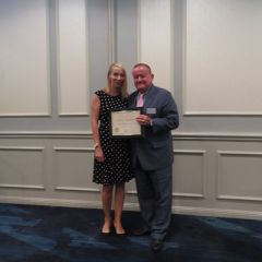 Jessica Hegarty, Presidential Commendations Award recipient,&nbsp;and President Russell Hartigan
